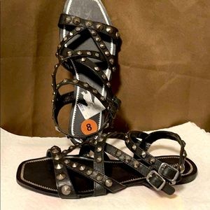 Black leather studies sandals